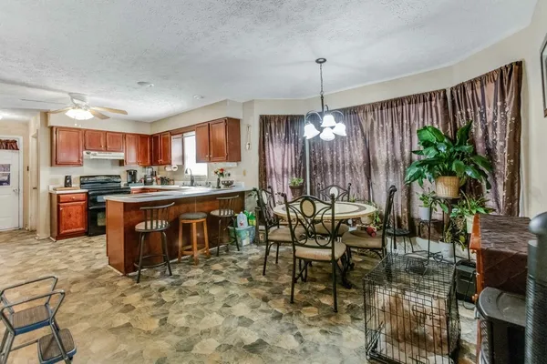 a open kitchen with a table and chairs in it