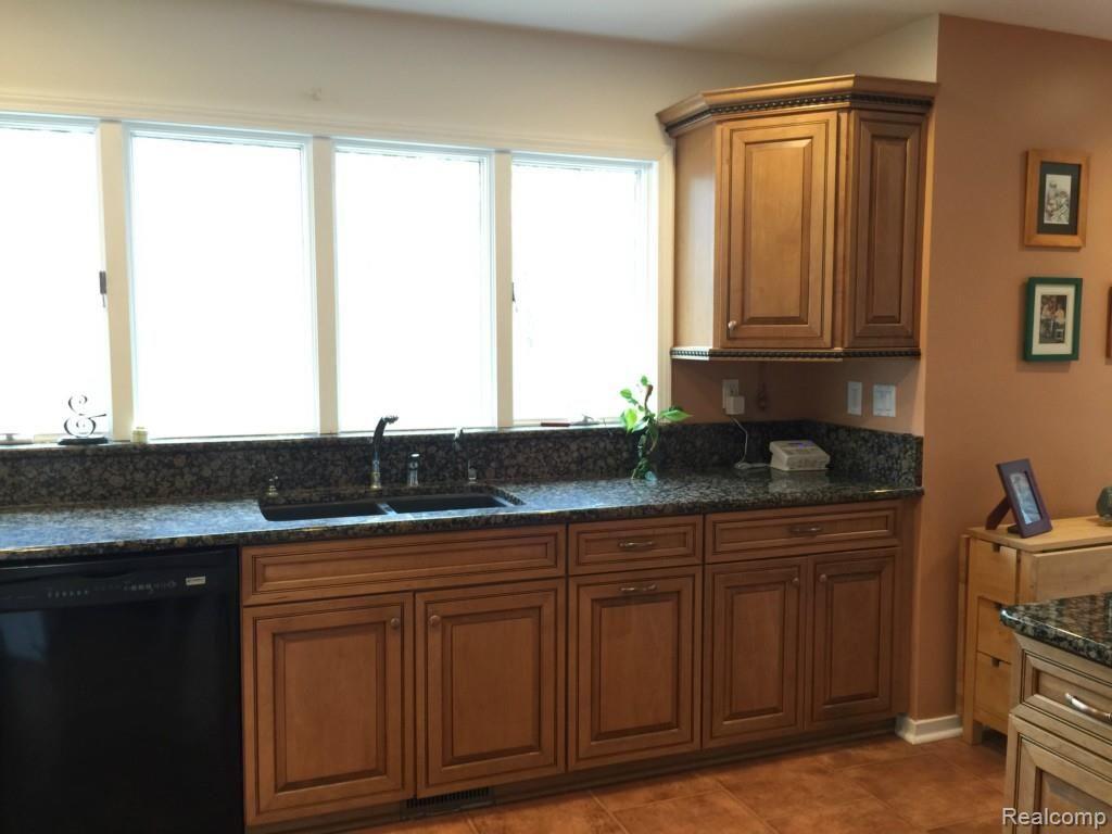 5141 Argentine Road Howell, MI 48855 - Photo 10 of 37 More cabinets and lots of windows to enjoy the view