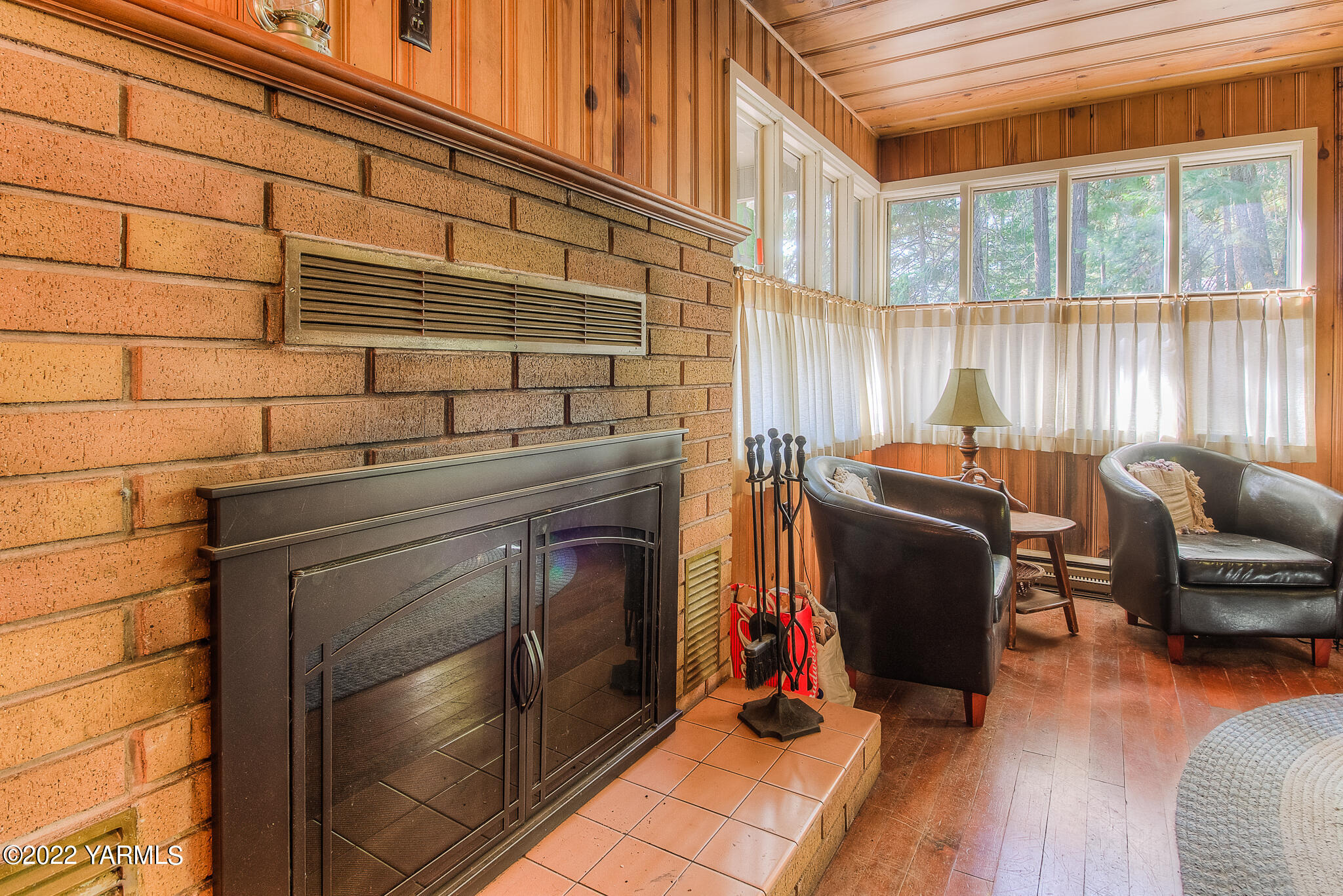 35941 Highway 12, Unit 12 Naches, WA 98937 - Photo 12 of 37 a living room with furniture a fireplace and wooden floor