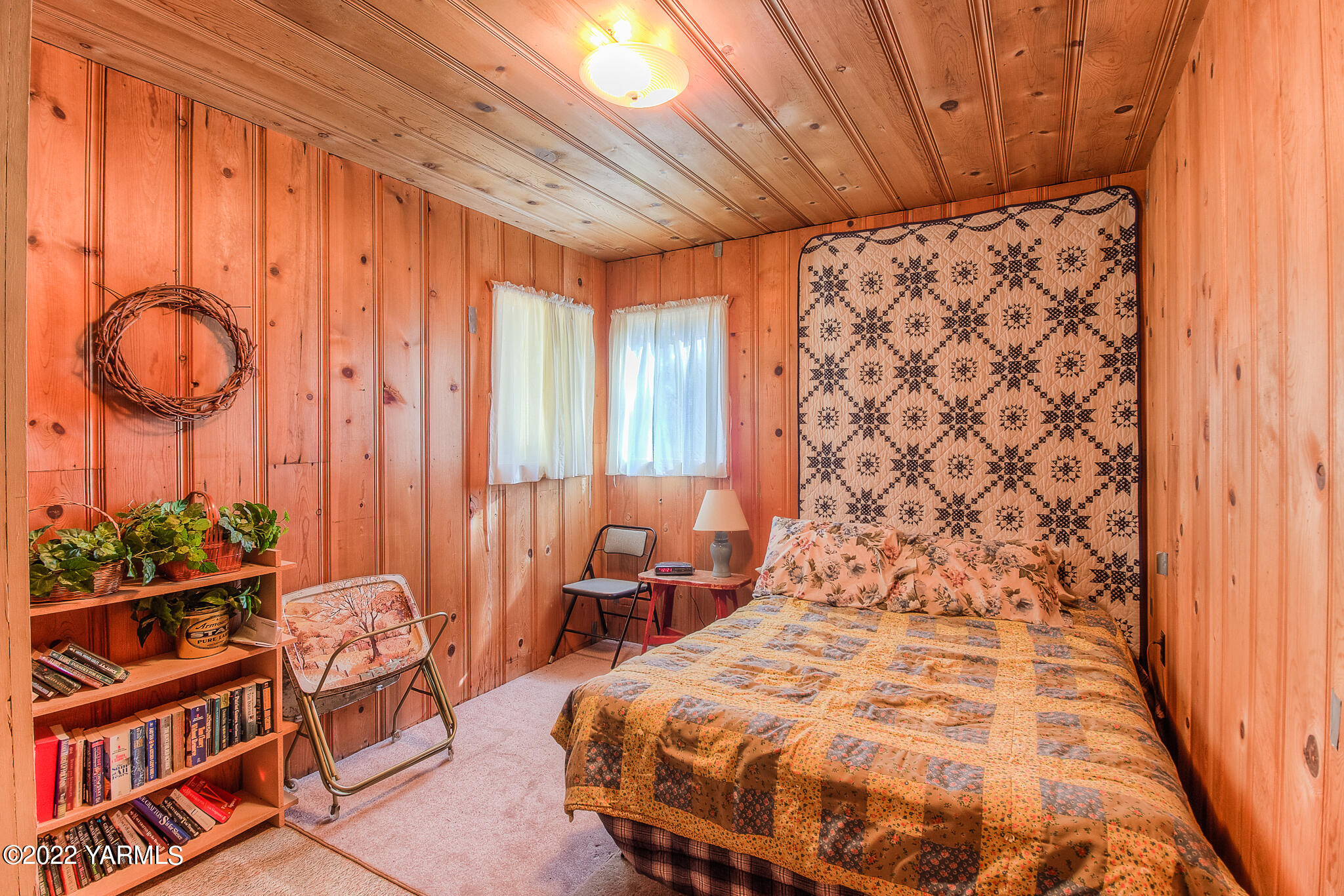 35941 Highway 12, Unit 12 Naches, WA 98937 - Photo 17 of 37 a spacious bedroom with a bed and a chandelier