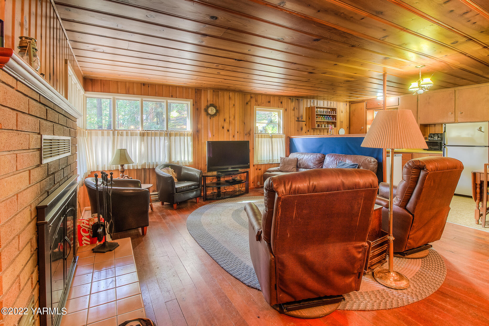 35941 Highway 12, Unit 12 Naches, WA 98937 - Photo 6 of 37 a living room with furniture a wooden floor and a large window