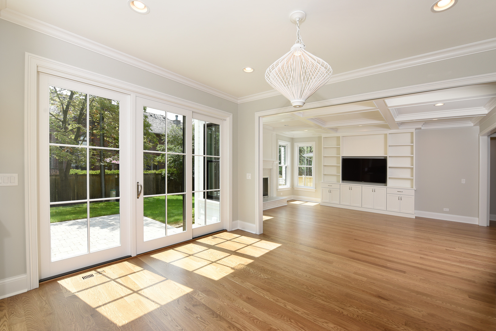 443 Hill Road Winnetka, IL 60093 - Photo 7 of 12 a view of empty room with wooden floor and fan