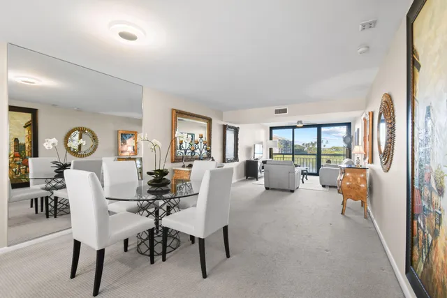 a living room with furniture and a flat screen tv with wooden floor