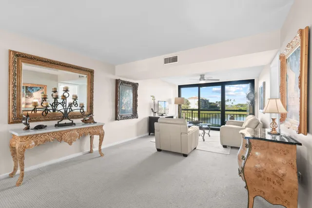 a bedroom with a large bed and a large window