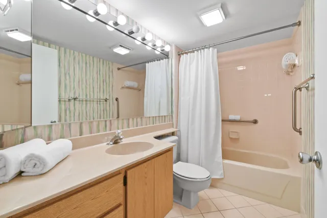 a view of a lake with houses in the back