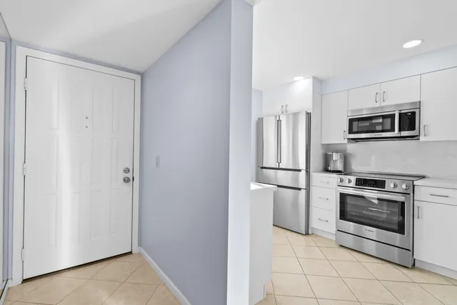 a bathroom with a sink a vanity and a mirror