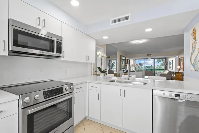 a kitchen with center island and windows