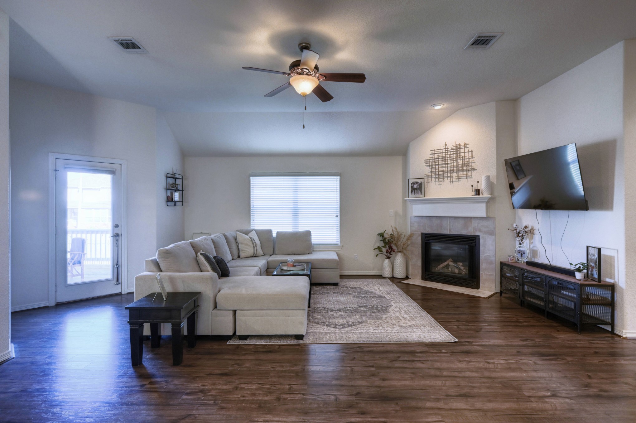 108 Cove Circle Conroe, TX 77356 - Photo 12 of 50 Embrace warmth and charm in the living room, where a focal point fireplace with a mantle takes center stage, creating a cozy ambiance for gatherings.