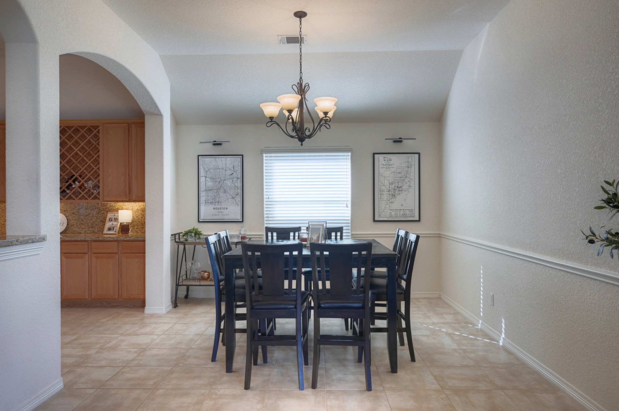 108 Cove Circle Conroe, TX 77356 - Photo 16 of 50 Enter the generously proportioned dining room showcased in this photo, where ample room welcomes a substantial table and furniture effortlessly. This inviting space sets the stage for memorable meals and gatherings, striking the perfect balance between comfort and sophistication for both everyday use and special occasions.