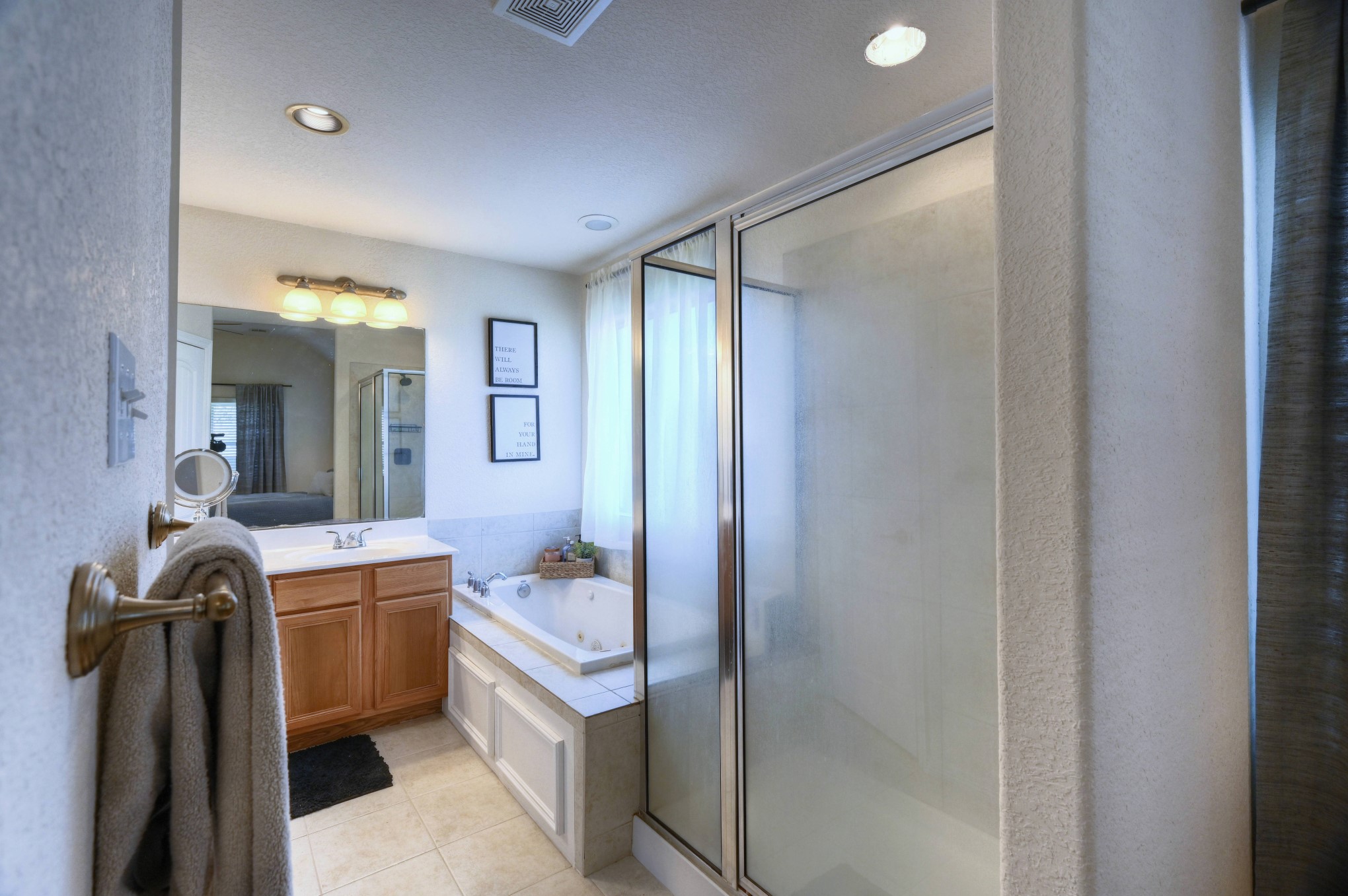 108 Cove Circle Conroe, TX 77356 - Photo 27 of 50 Step into comfort with this photo revealing the entry to the primary bathroom, where a separate tub and shower await.