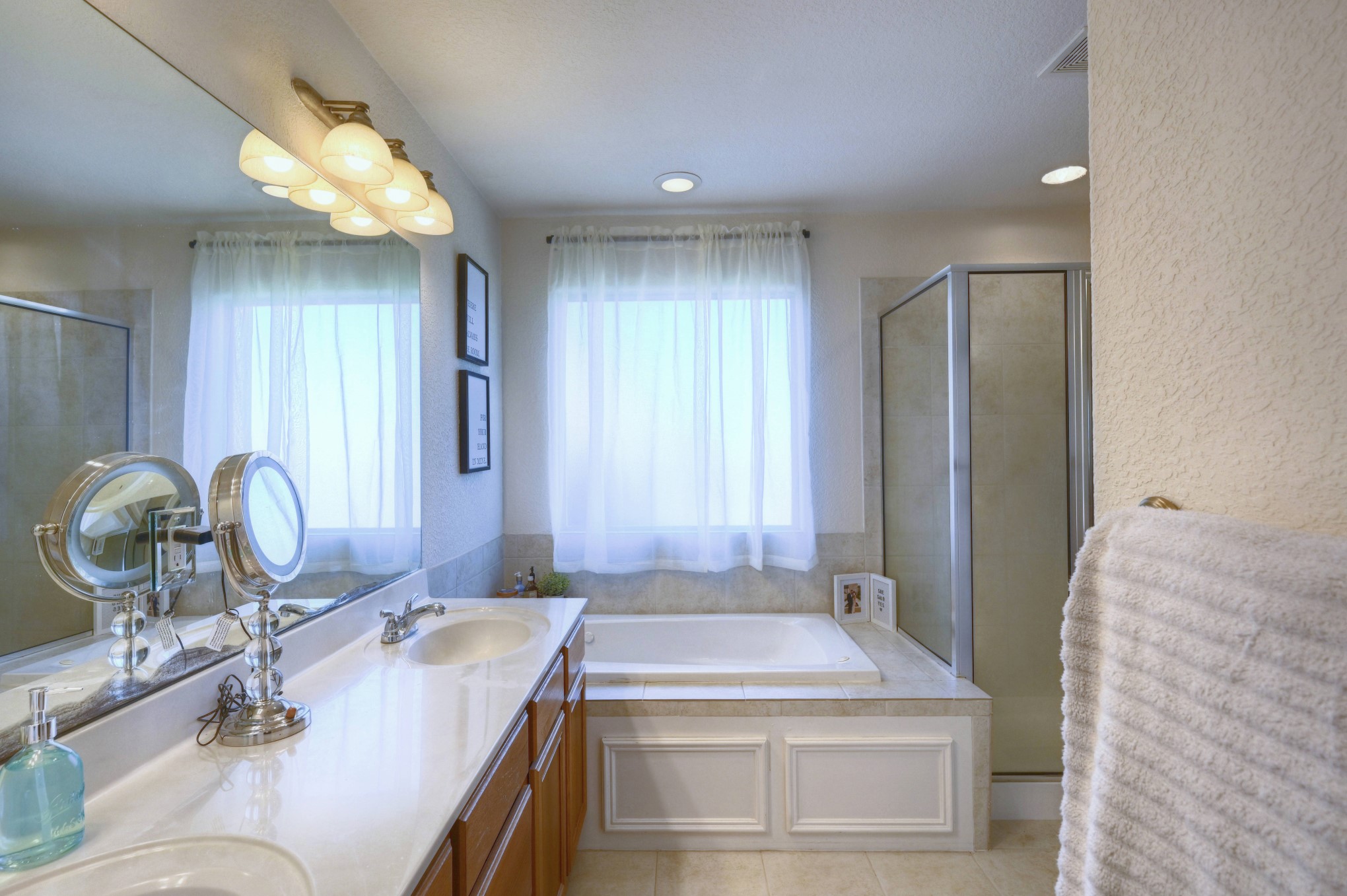 108 Cove Circle Conroe, TX 77356 - Photo 29 of 50 Discover the upgraded features in the primary bathroom with double sinks and brand-new faucets.