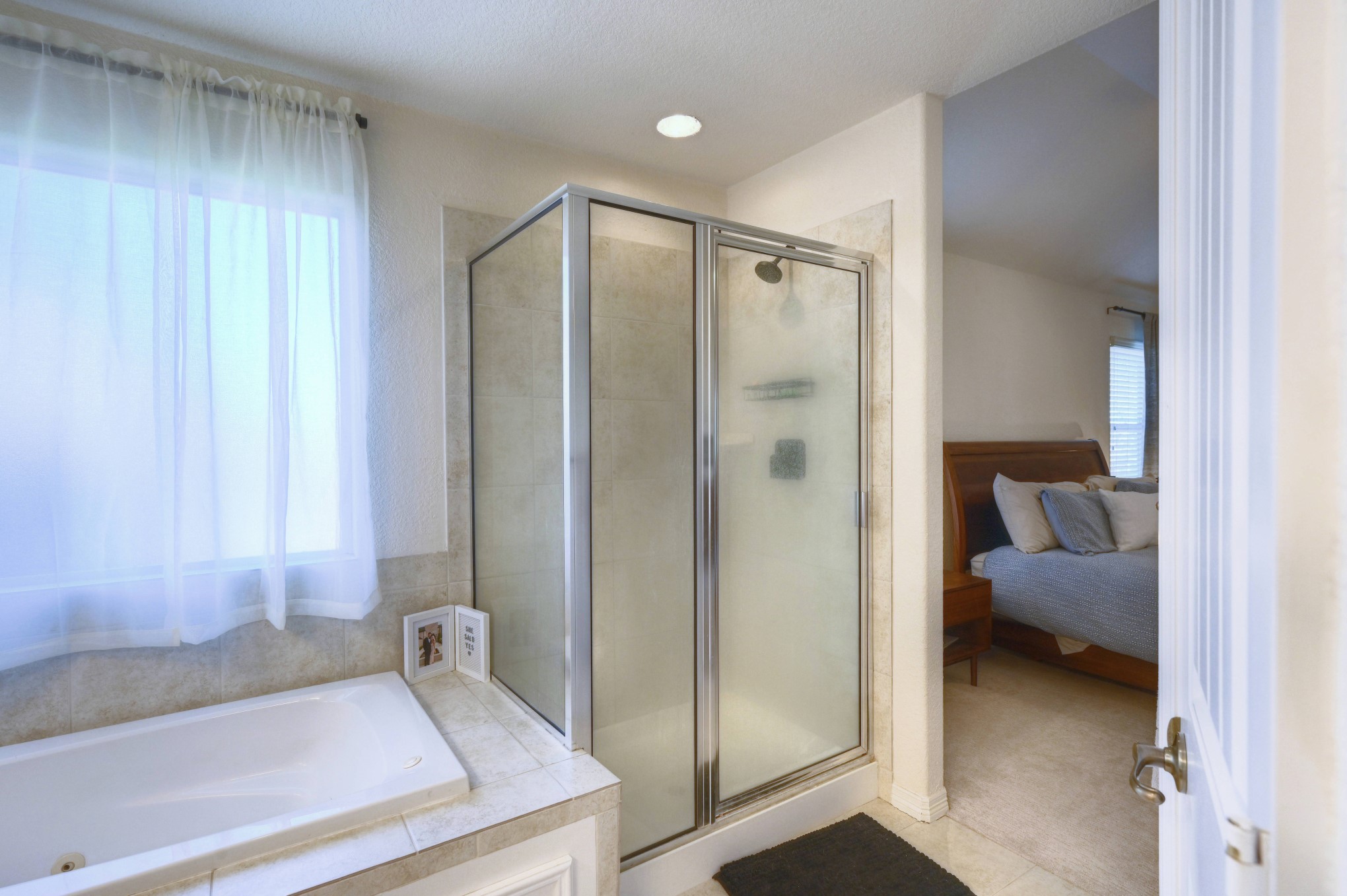 108 Cove Circle Conroe, TX 77356 - Photo 30 of 50 Featuring a brand-new shower fixture, this addition not only elevates the aesthetic but also promises a refreshing and enjoyable shower experience, making this space a stylish retreat within the home.