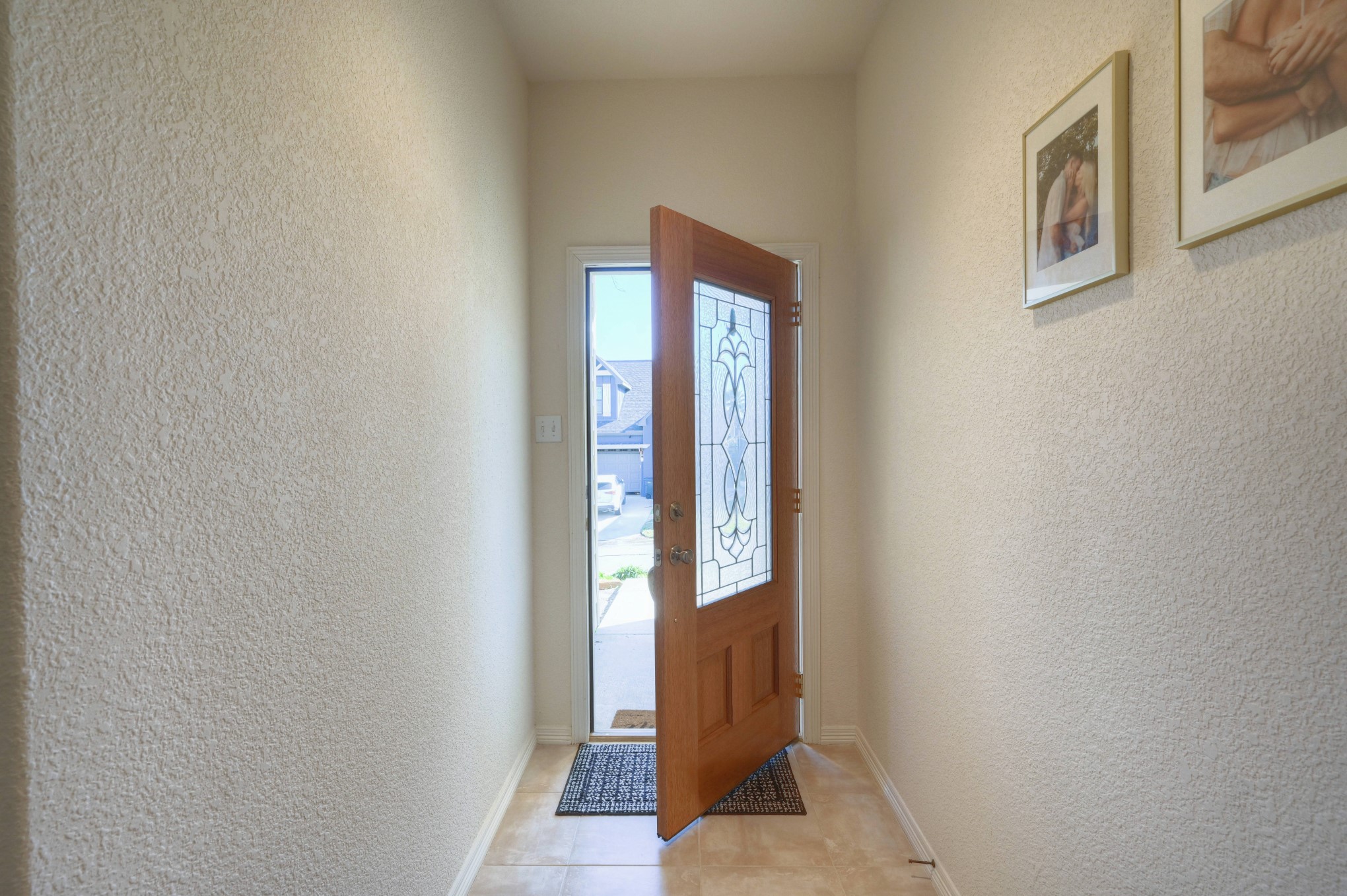 108 Cove Circle Conroe, TX 77356 - Photo 45 of 50 Bid farewell to the home in this photo, capturing the moment as the front door swings open to welcome you on your way out. This inviting image marks the end of your journey through the residence, leaving you with a sense of warmth and the promise of future memories in this charming abode.