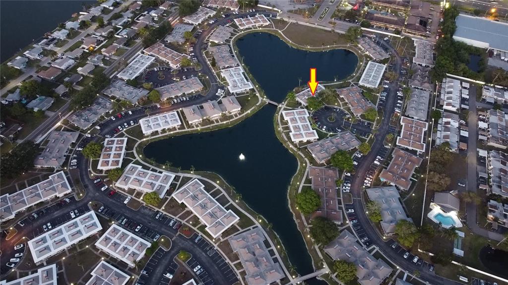 4318 Tahitian Gardens Circle, Unit B Holiday, FL 34691 - Photo 22 of 28 an aerial view of a house with a yard and large trees