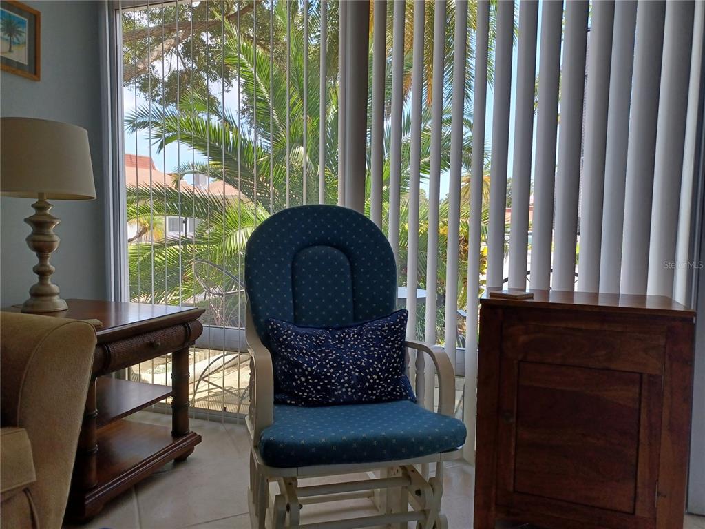 4318 Tahitian Gardens Circle, Unit B Holiday, FL 34691 - Photo 8 of 28 a living room with furniture and a fireplace