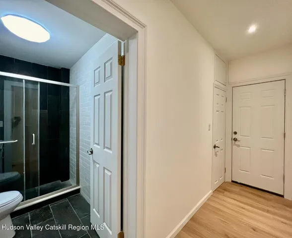 a view of a bathroom with a glass door