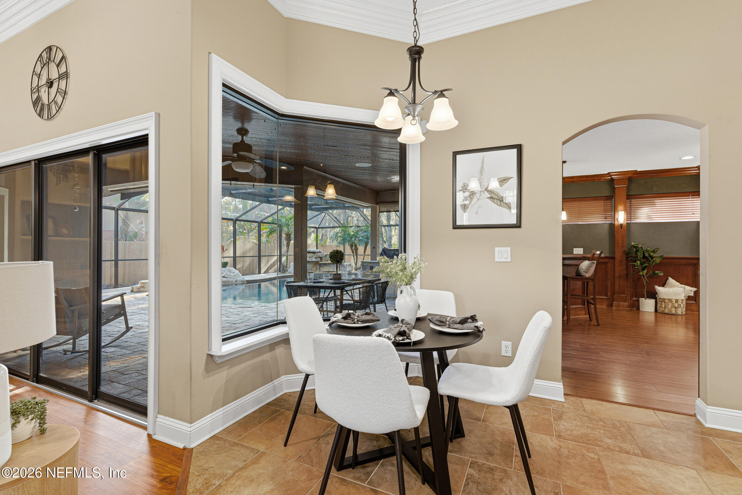 114 Warren Circle St. Johns, FL 32259 - Photo 10 of 32 a view of a dining room with furniture wooden floor and chandelier