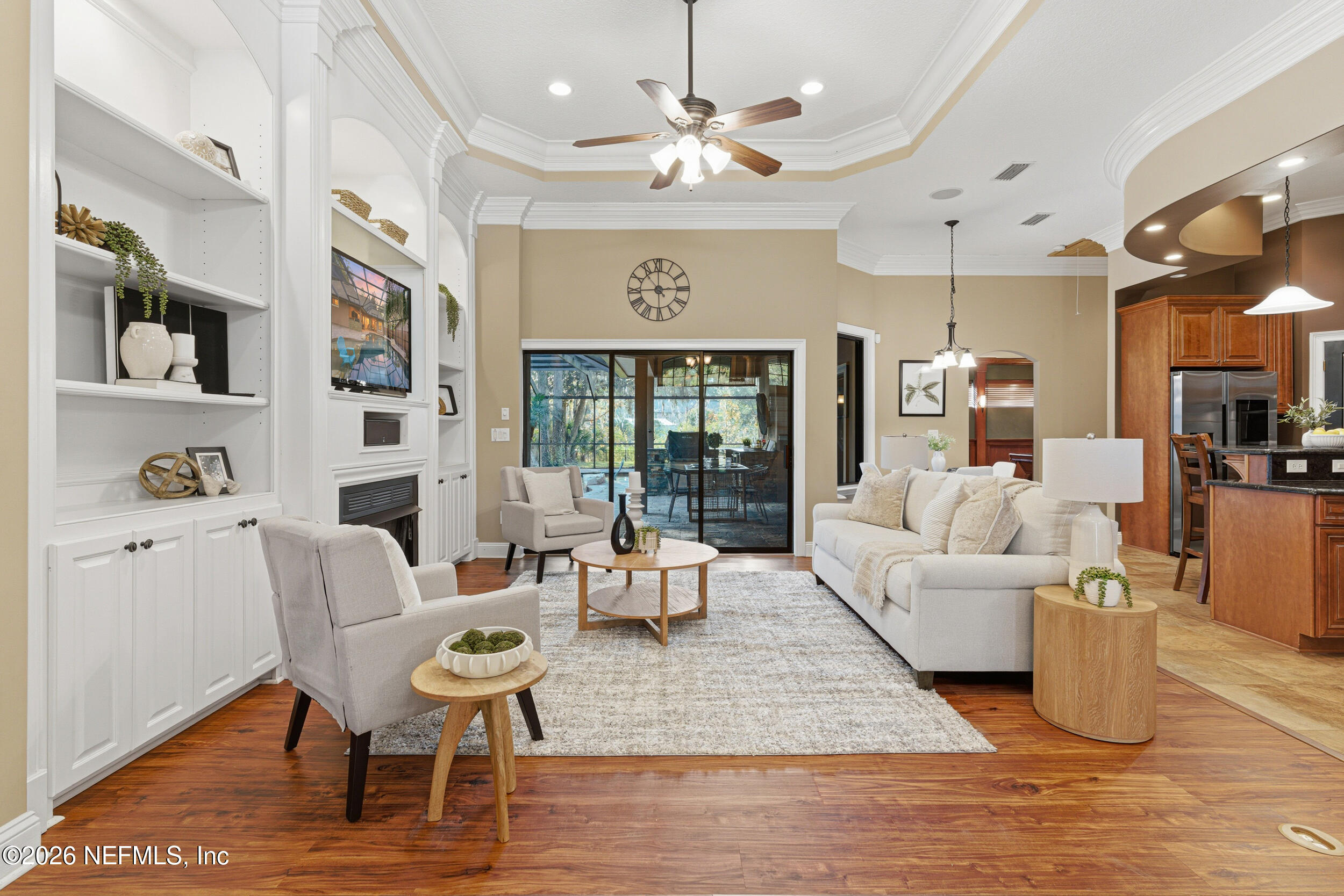 114 Warren Circle St. Johns, FL 32259 - Photo 7 of 32 a living room with furniture wooden floor and a chandelier