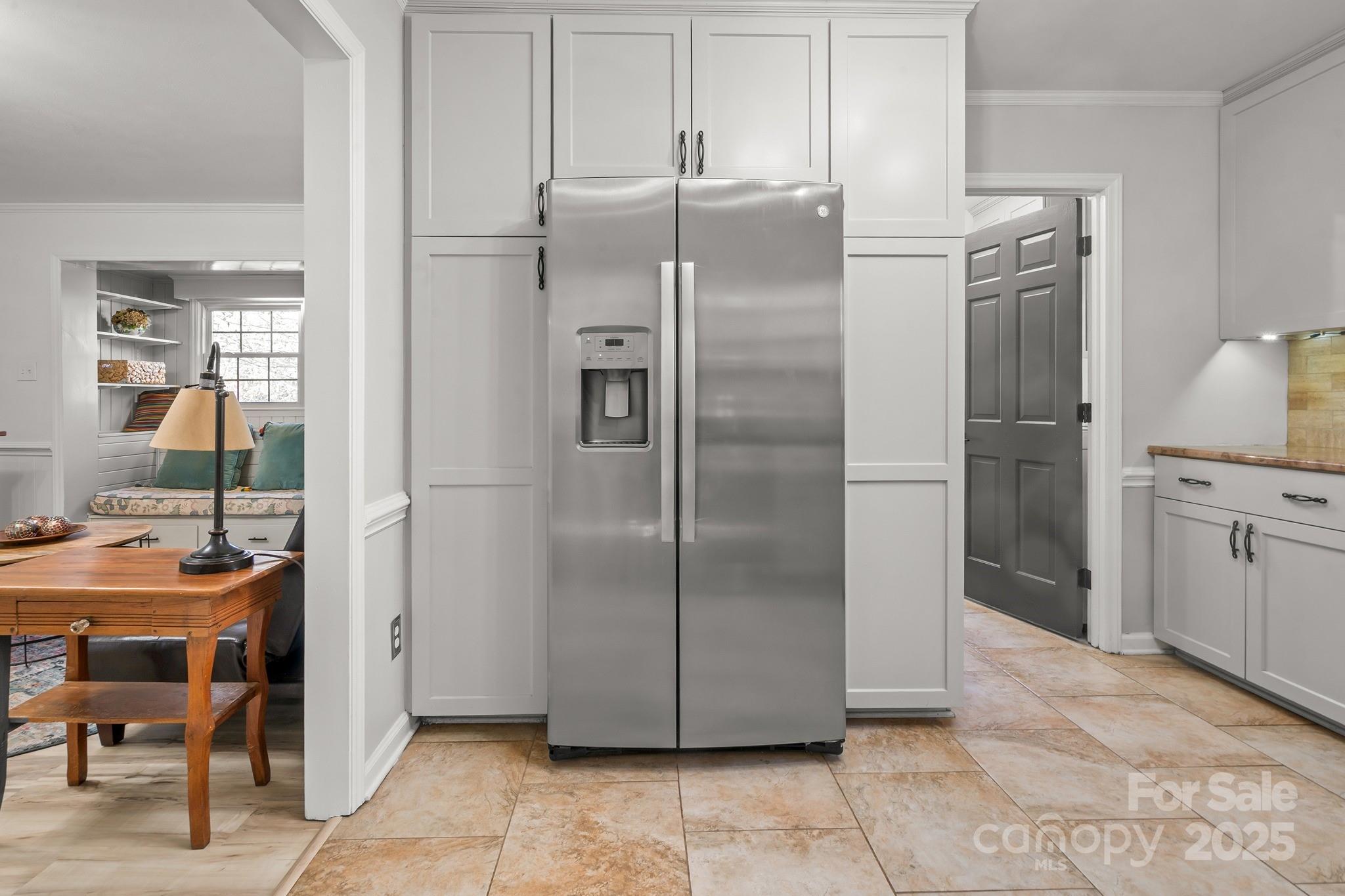 9211 Joyce Kilmer Drive Charlotte, NC 28213 - Photo 12 of 38 a kitchen with stainless steel appliances granite countertop a refrigerator and a sink