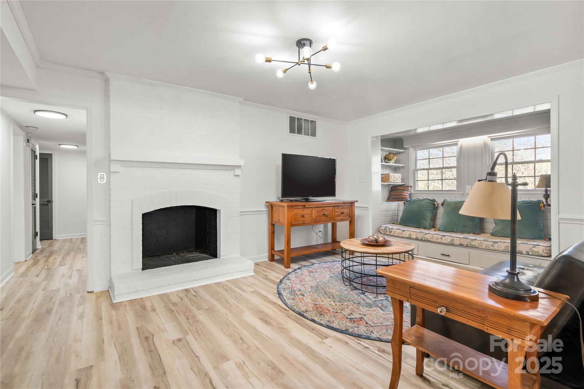 9211 Joyce Kilmer Drive Charlotte, NC 28213 - Photo 13 of 38 a living room with furniture a fireplace and a flat screen tv