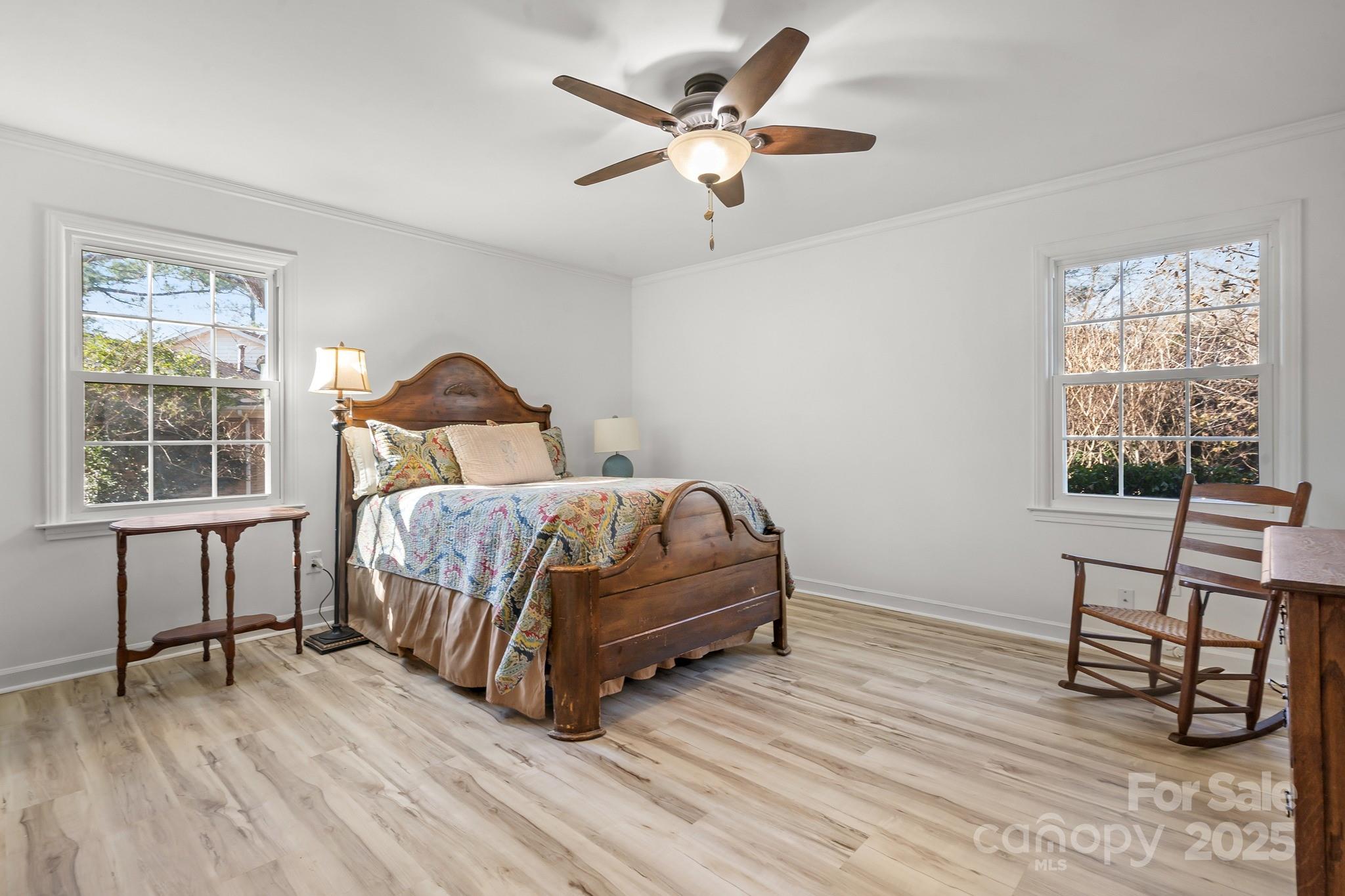 9211 Joyce Kilmer Drive Charlotte, NC 28213 - Photo 15 of 38 a bedroom with a bed and a table