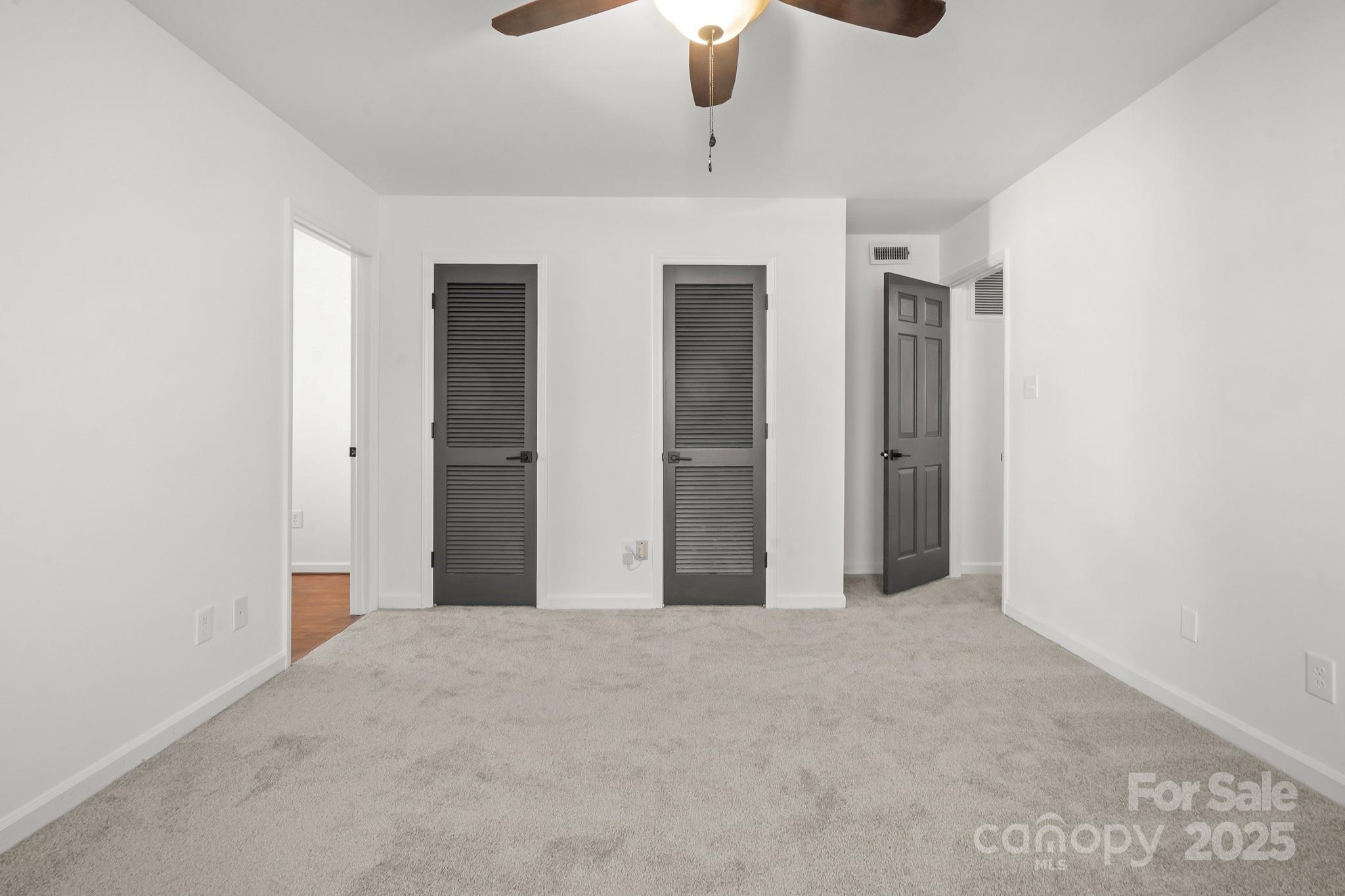 9211 Joyce Kilmer Drive Charlotte, NC 28213 - Photo 22 of 38 an empty room with chandelier fan