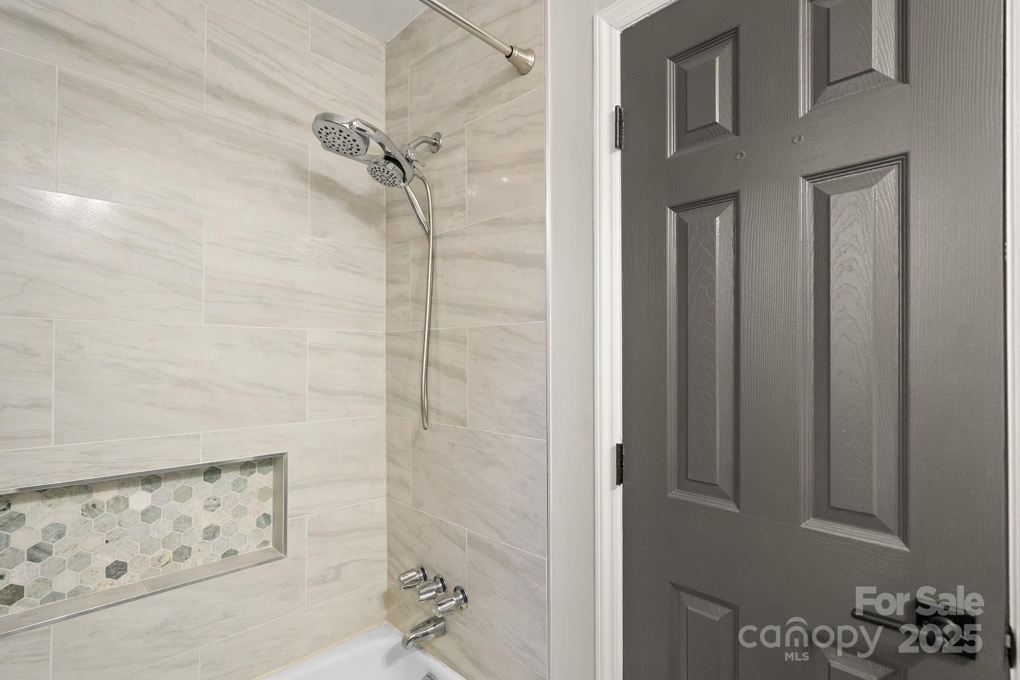 9211 Joyce Kilmer Drive Charlotte, NC 28213 - Photo 26 of 38 a bathroom with a bathtub