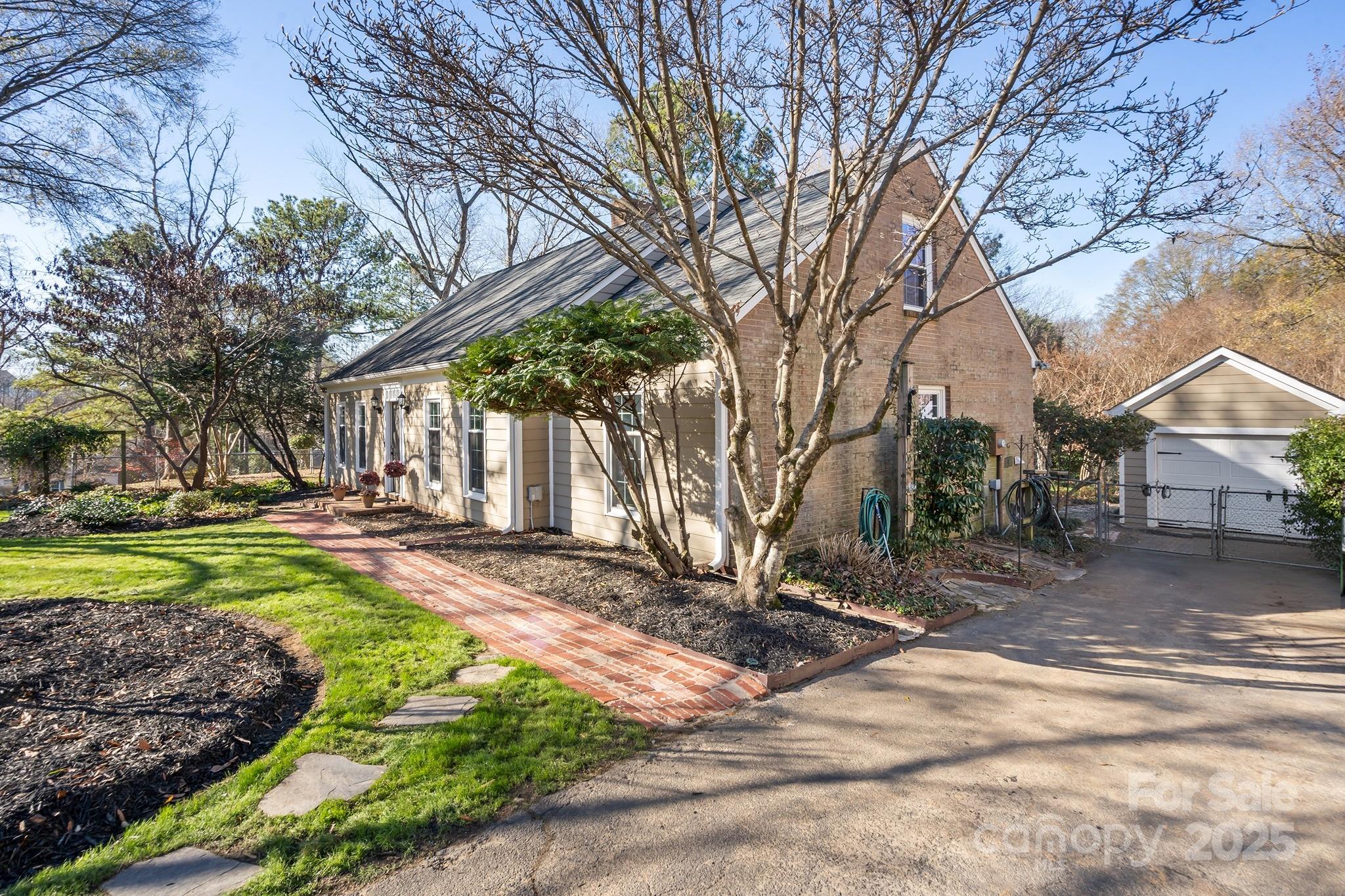 9211 Joyce Kilmer Drive Charlotte, NC 28213 - Photo 3 of 38 a view of a yard with a house