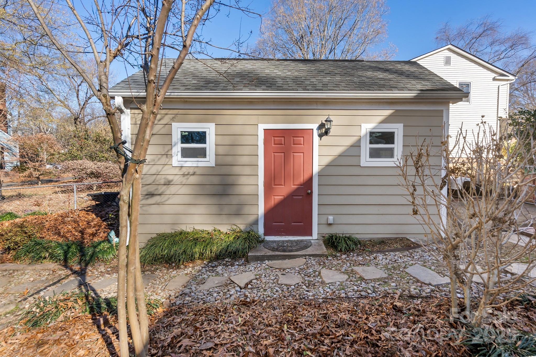 9211 Joyce Kilmer Drive Charlotte, NC 28213 - Photo 33 of 38 a view of a house with a yard