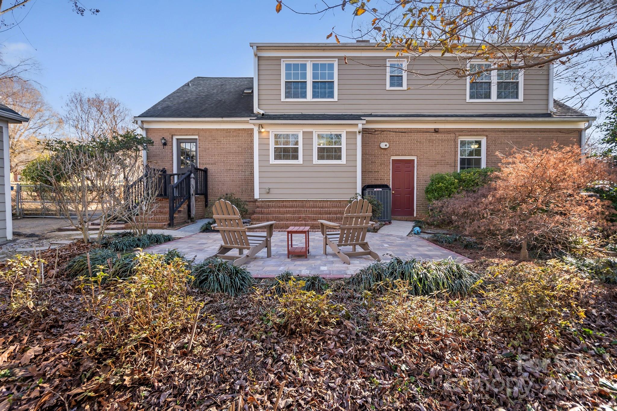9211 Joyce Kilmer Drive Charlotte, NC 28213 - Photo 34 of 38 front view of a house with a yard