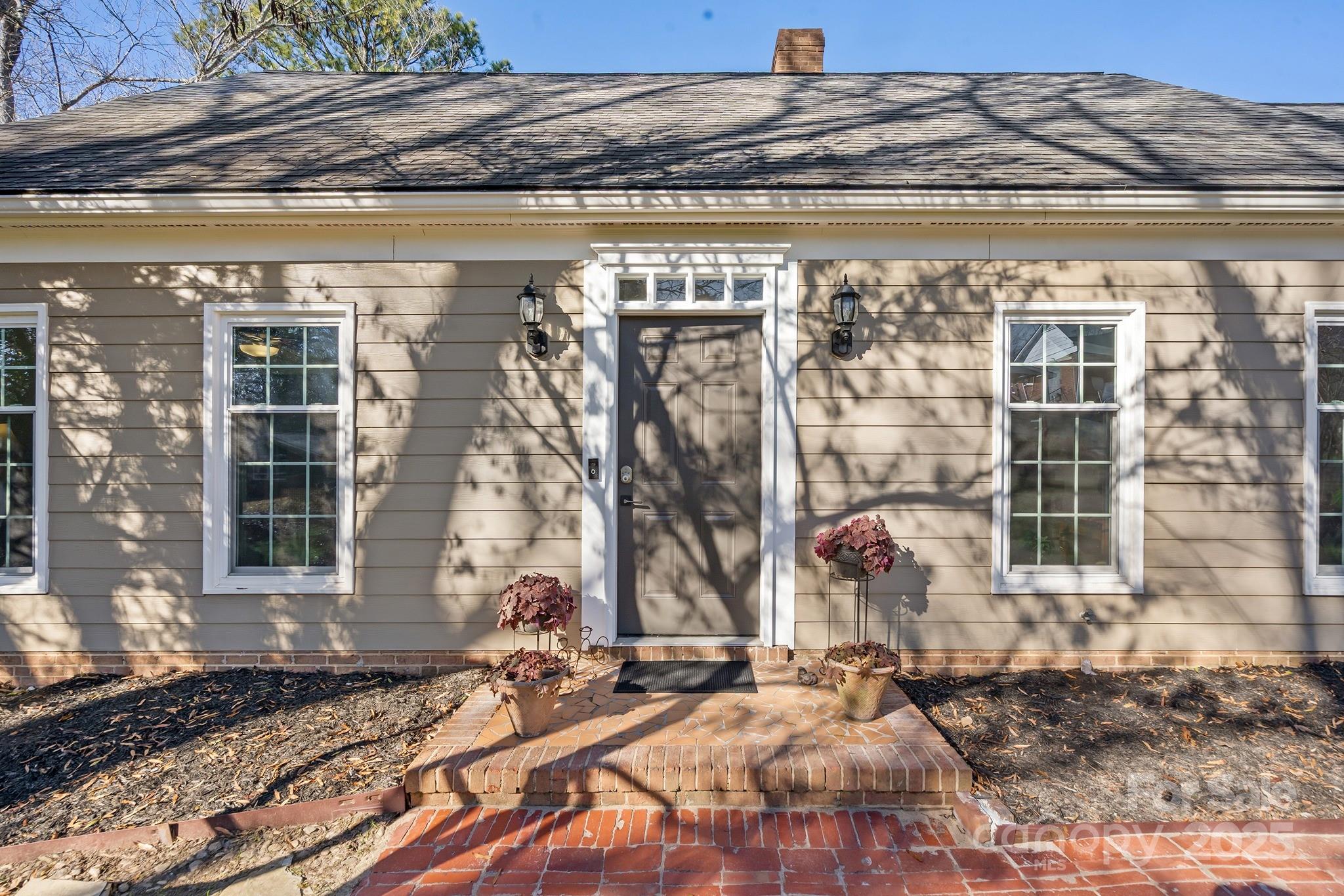 9211 Joyce Kilmer Drive Charlotte, NC 28213 - Photo 4 of 38 a front view of a house