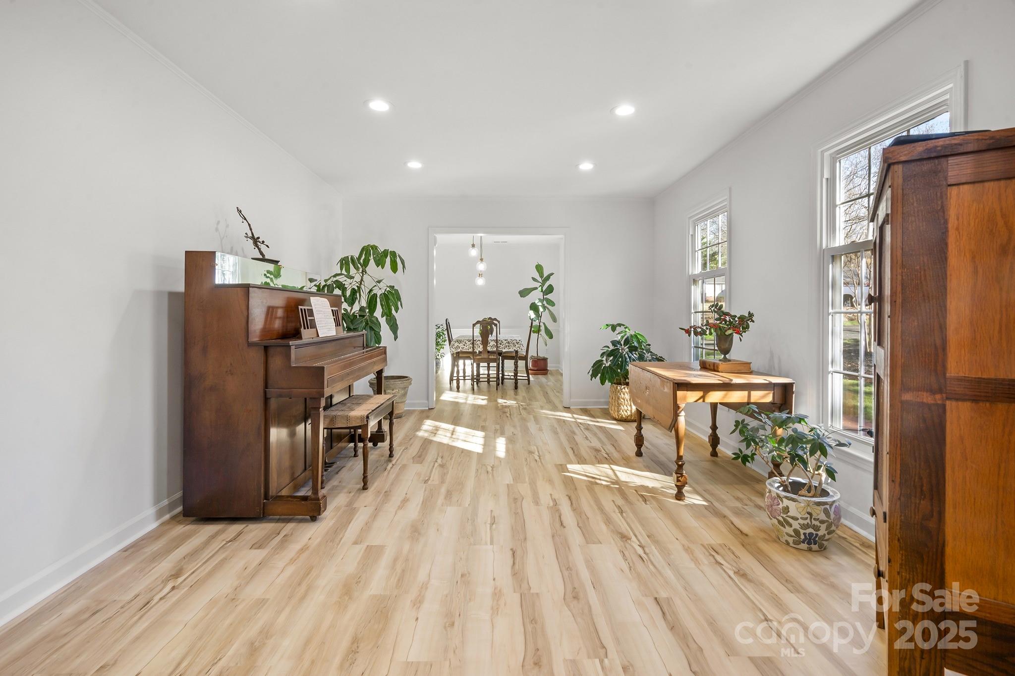 9211 Joyce Kilmer Drive Charlotte, NC 28213 - Photo 7 of 38 a living room with furniture a wooden floor and a sink