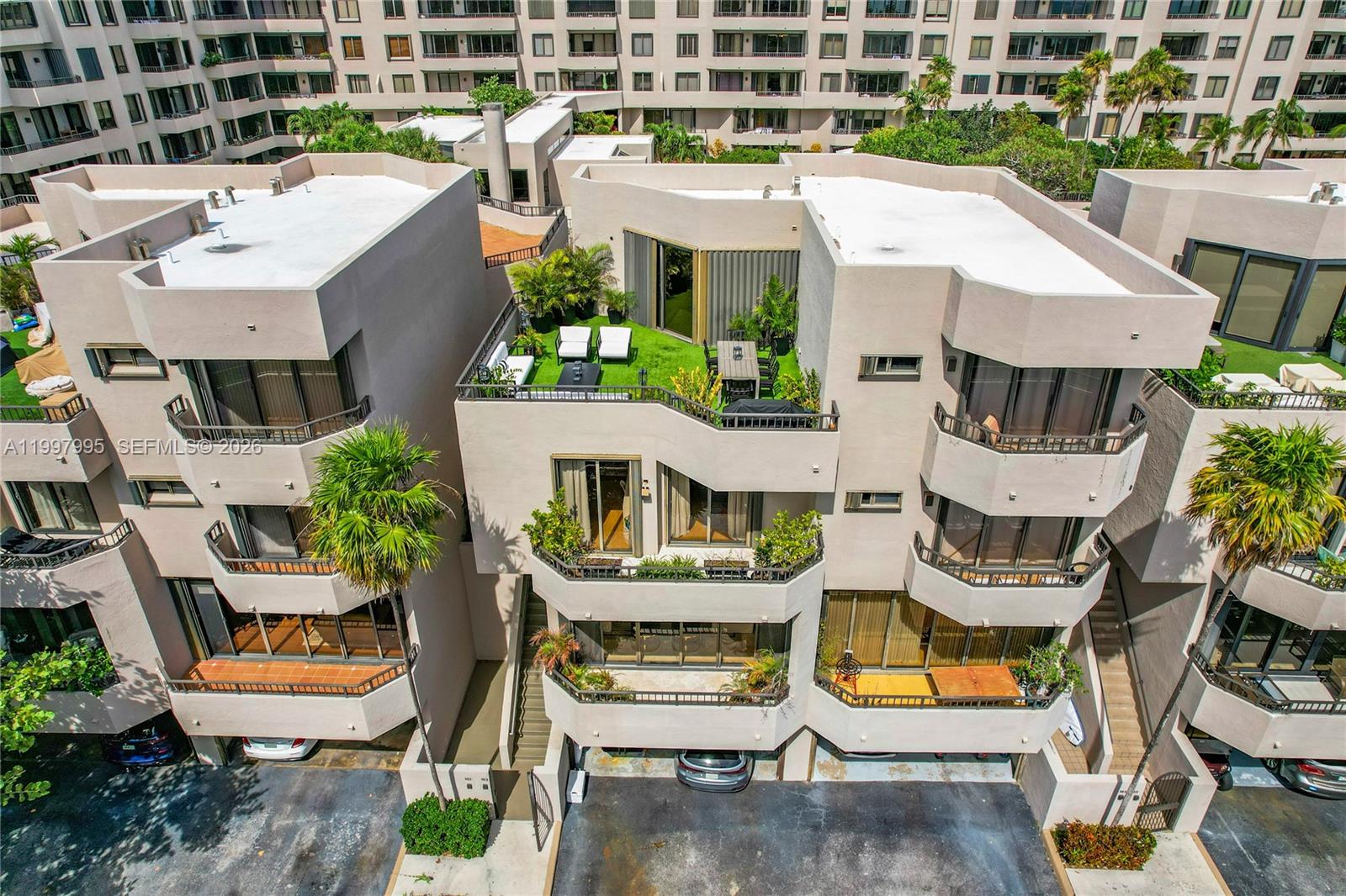 an aerial view of a house with outdoor seating