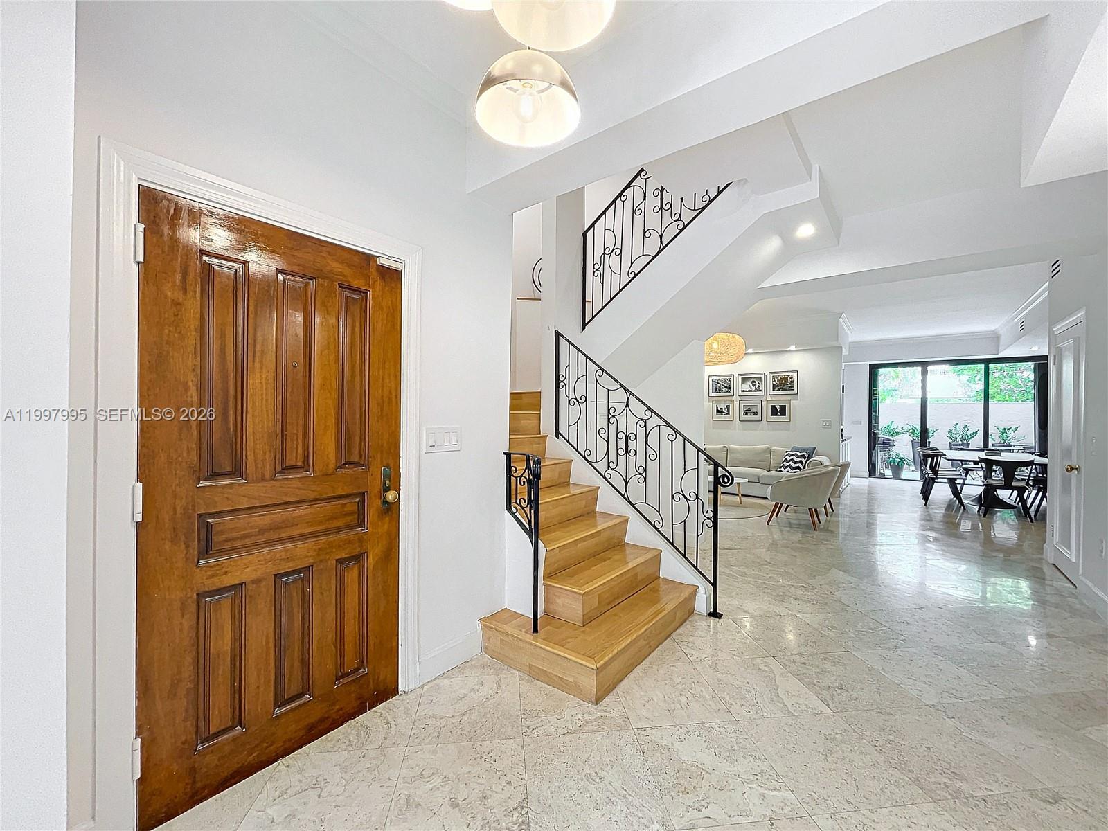 Key Colony Condominiums Key Biscayne, FL 33149 - Photo 11 of 29 wooden floor view with staircase and living room