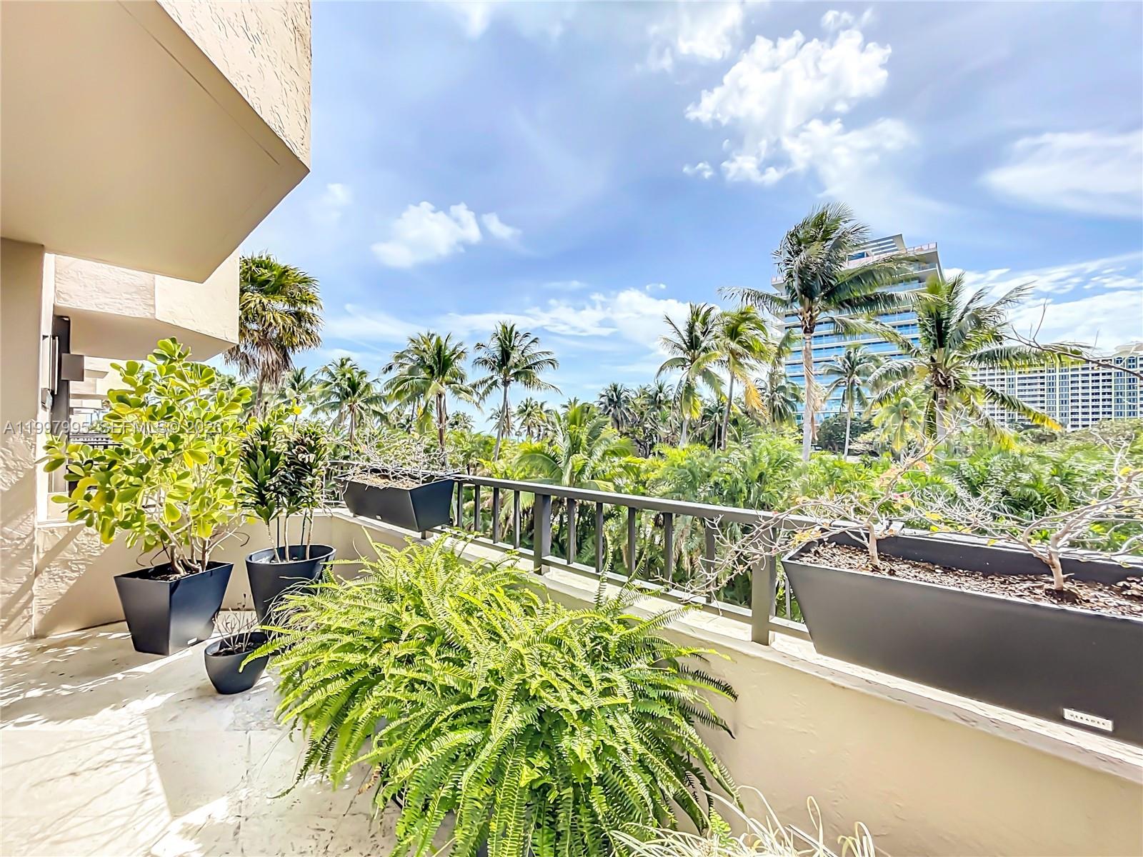 Key Colony Condominiums Key Biscayne, FL 33149 - Photo 13 of 29 a view of a swimming pool with a patio