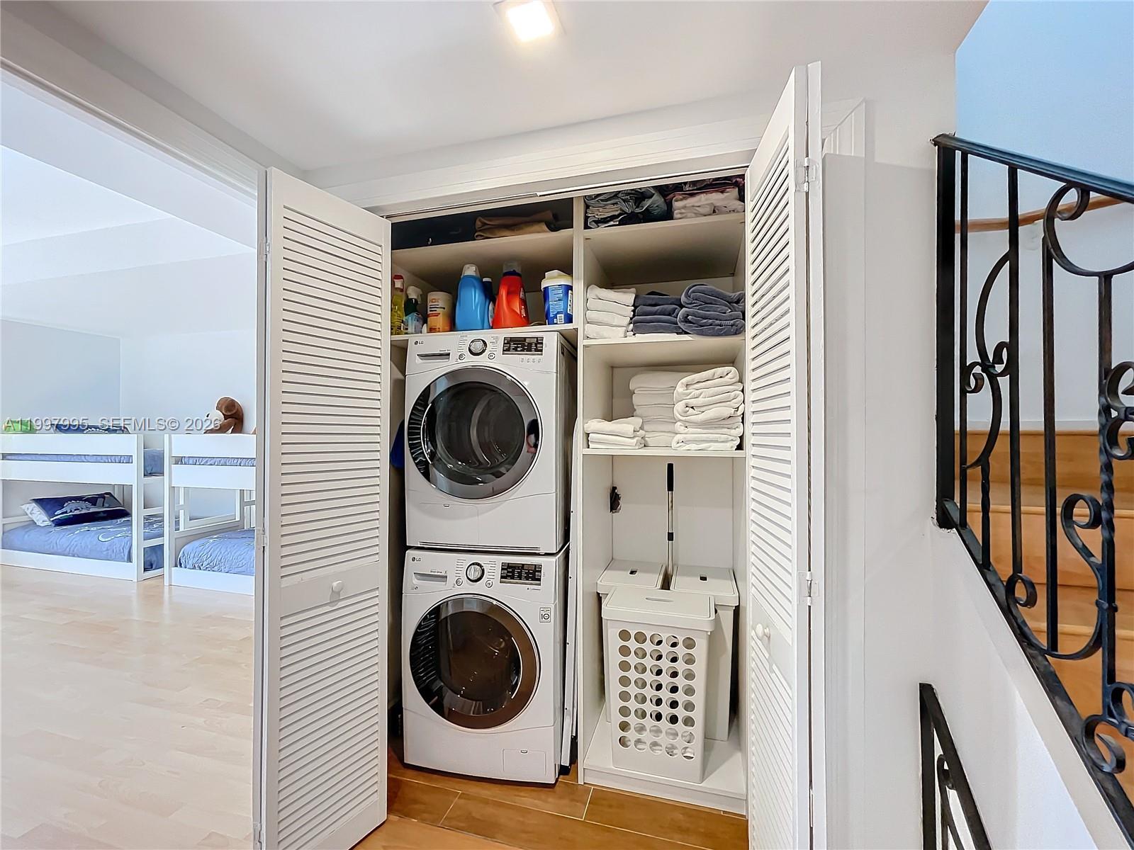 Key Colony Condominiums Key Biscayne, FL 33149 - Photo 17 of 29 a utility room with dryer and washer