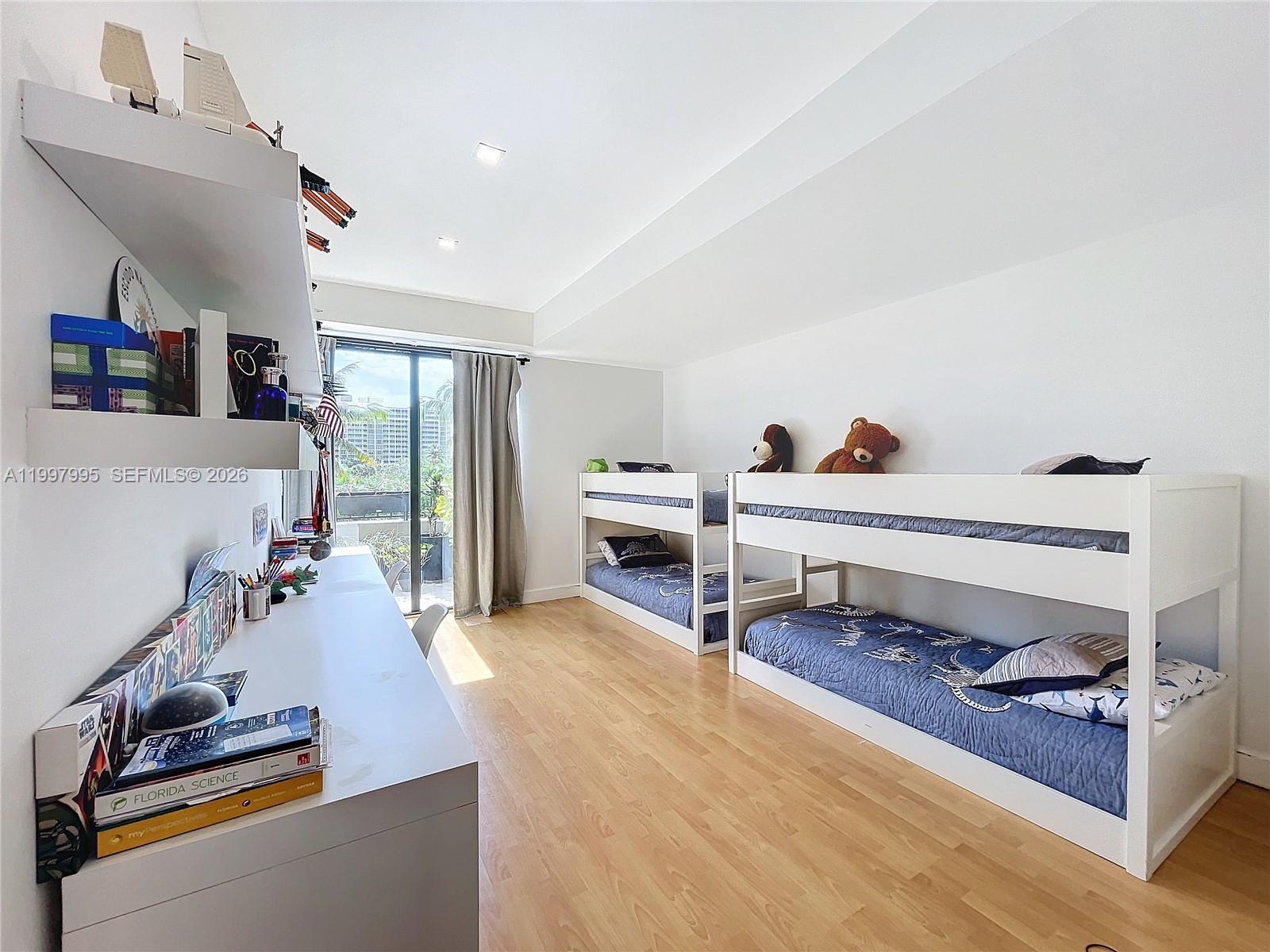 Key Colony Condominiums Key Biscayne, FL 33149 - Photo 18 of 29 a living room with furniture and a flat screen tv