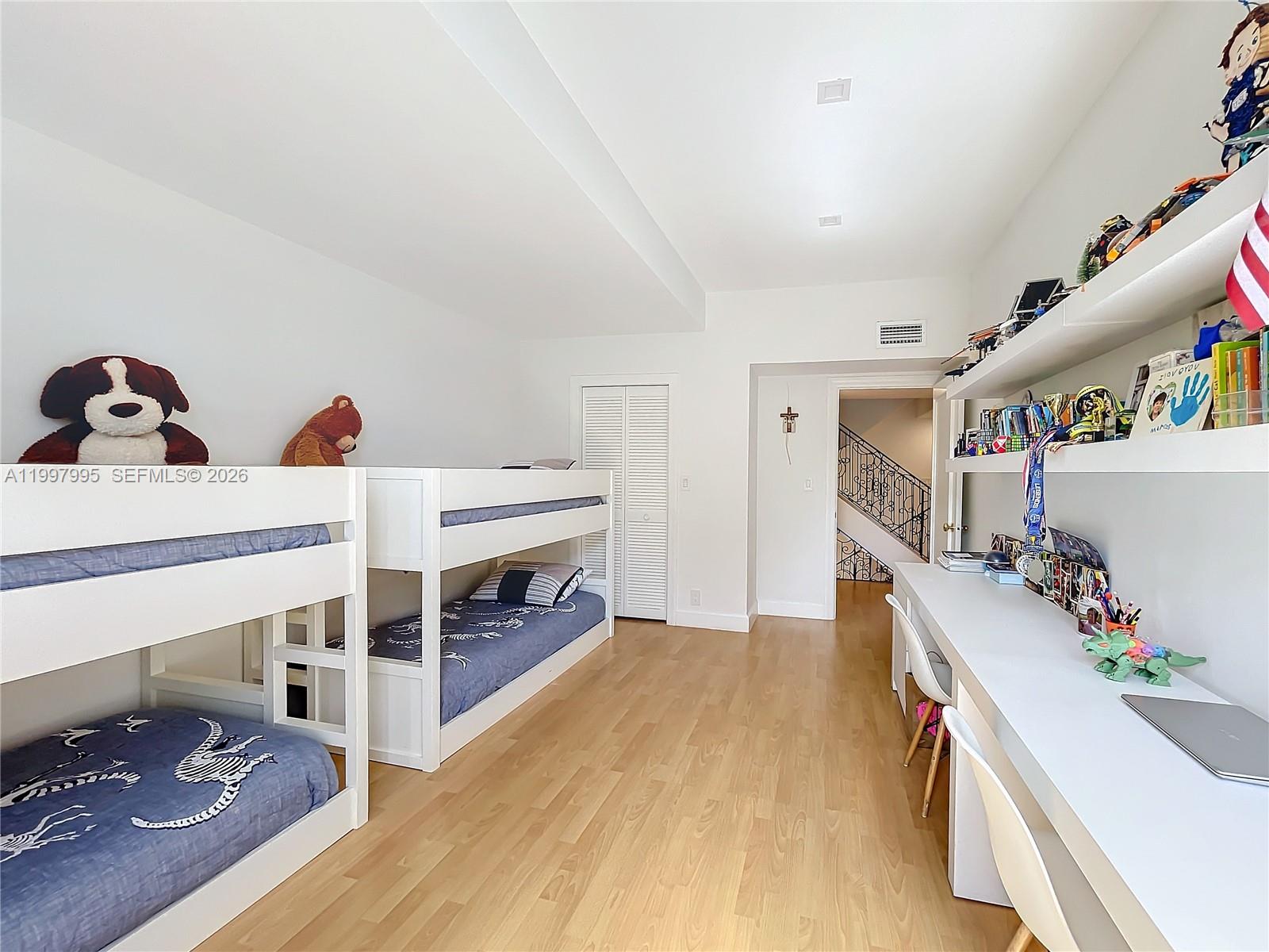 Key Colony Condominiums Key Biscayne, FL 33149 - Photo 19 of 29 a room with furniture and storage