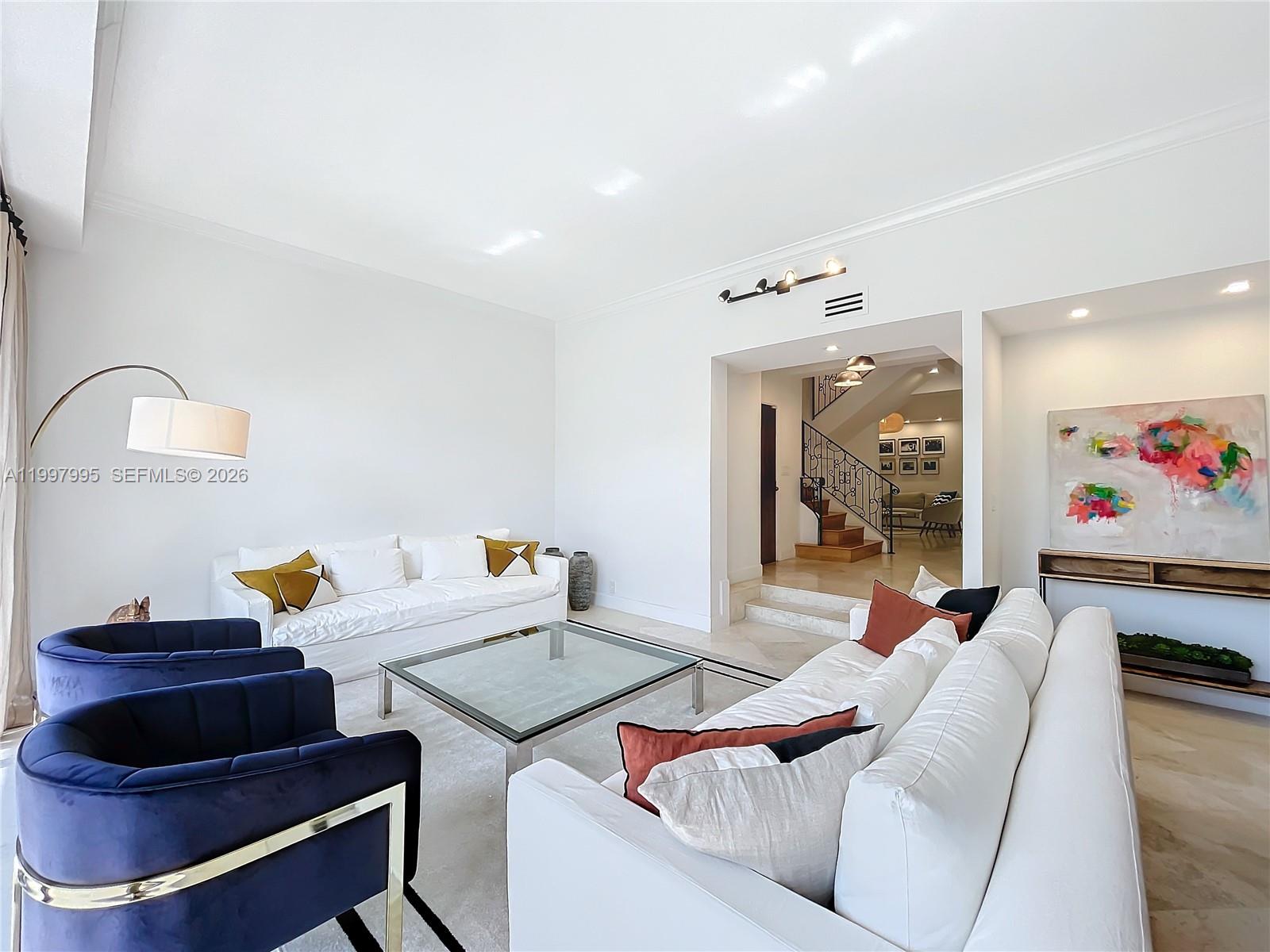 Key Colony Condominiums Key Biscayne, FL 33149 - Photo 2 of 29 a living room with furniture and a mirror