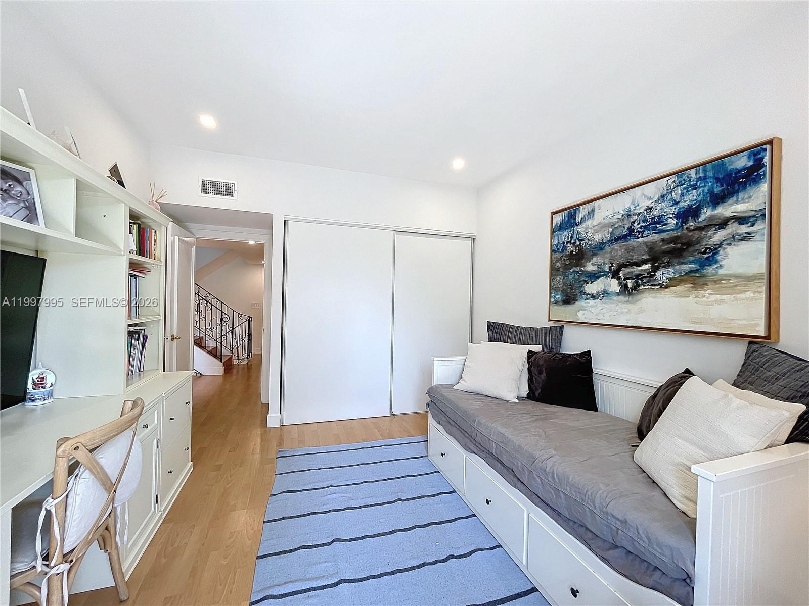 Key Colony Condominiums Key Biscayne, FL 33149 - Photo 21 of 29 a living room with furniture and a flat screen tv