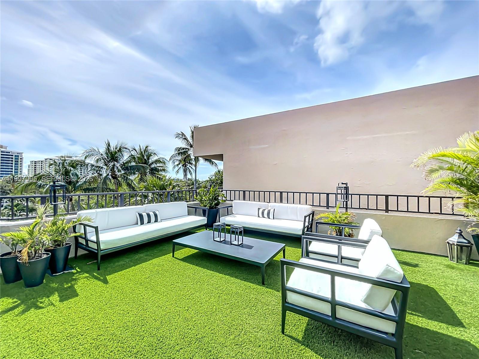 Key Colony Condominiums Key Biscayne, FL 33149 - Photo 24 of 29 a roof deck with couches and potted plants with sky view