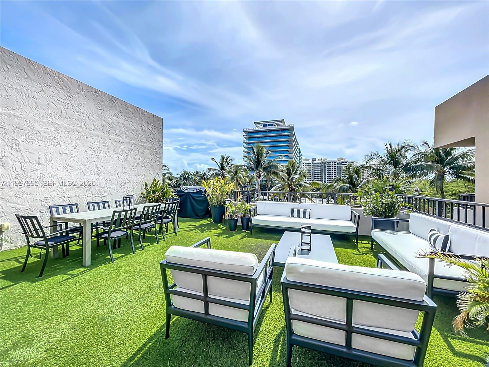 Key Colony Condominiums Key Biscayne, FL 33149 - Photo 25 of 29 a view of yard with outdoor seating and green space