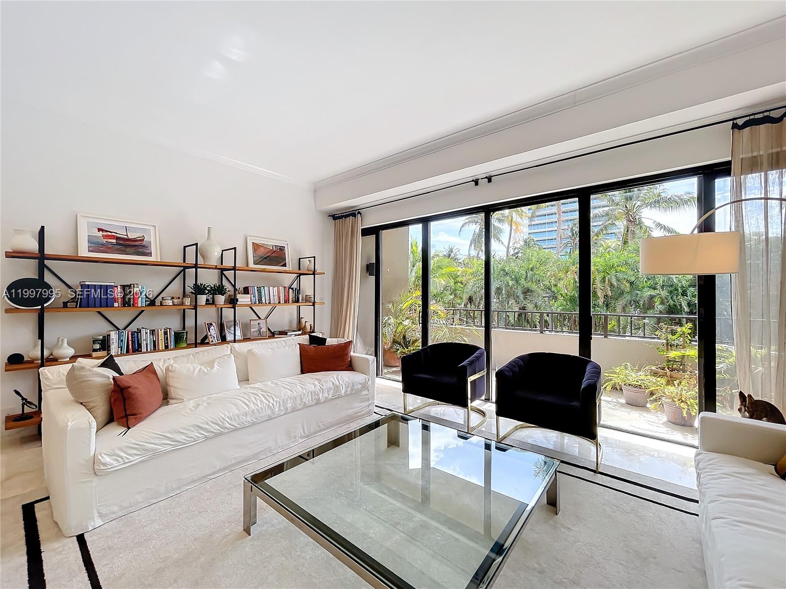 Key Colony Condominiums Key Biscayne, FL 33149 - Photo 3 of 29 a living room with furniture and a large window