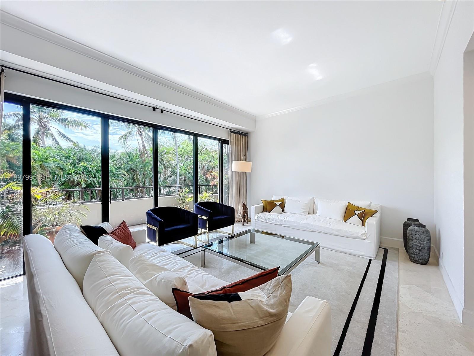 Key Colony Condominiums Key Biscayne, FL 33149 - Photo 4 of 29 a living room with furniture and large windows