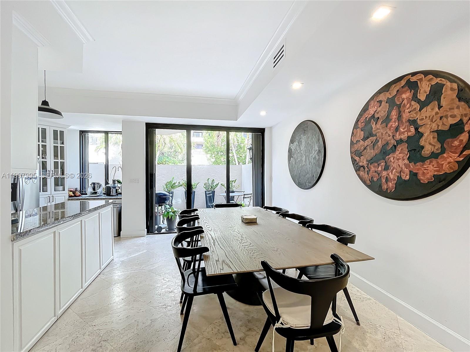Key Colony Condominiums Key Biscayne, FL 33149 - Photo 5 of 29 a view of a dining room with furniture window and wooden floor