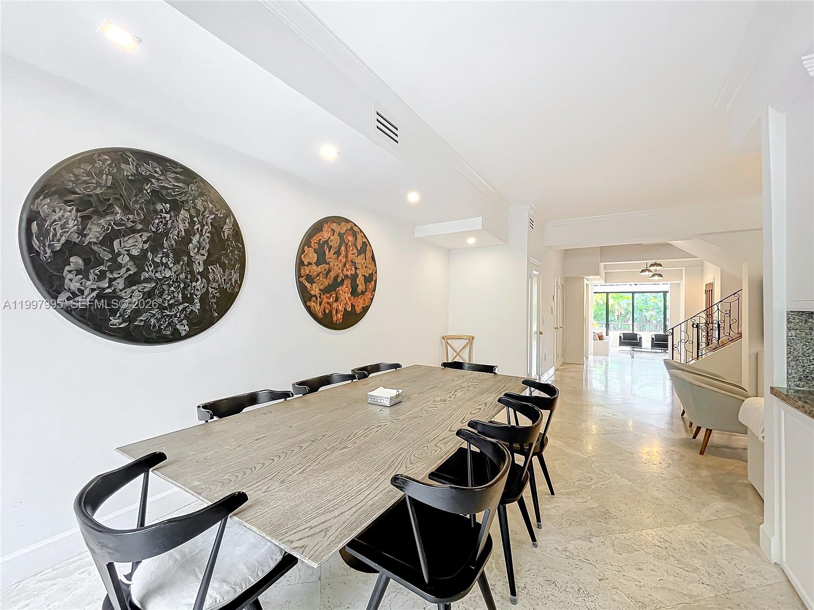 Key Colony Condominiums Key Biscayne, FL 33149 - Photo 7 of 29 a view of a dining room with furniture and a large window