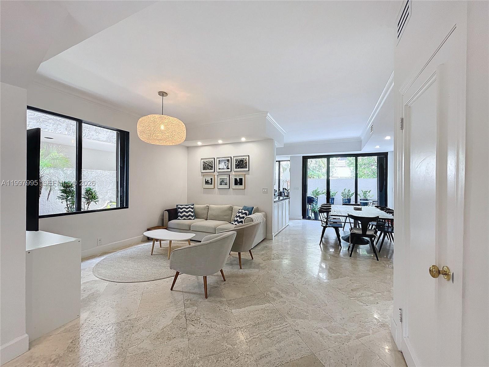 Key Colony Condominiums Key Biscayne, FL 33149 - Photo 8 of 29 a living room with furniture and a large window