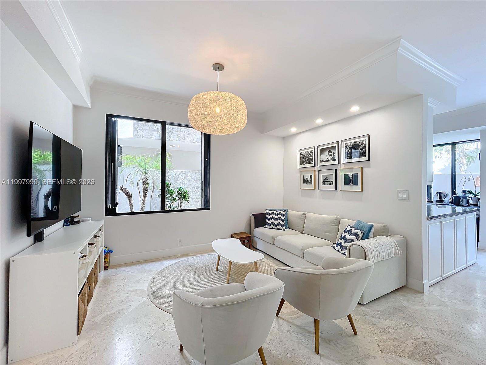 Key Colony Condominiums Key Biscayne, FL 33149 - Photo 9 of 29 a living room with furniture and a flat screen tv