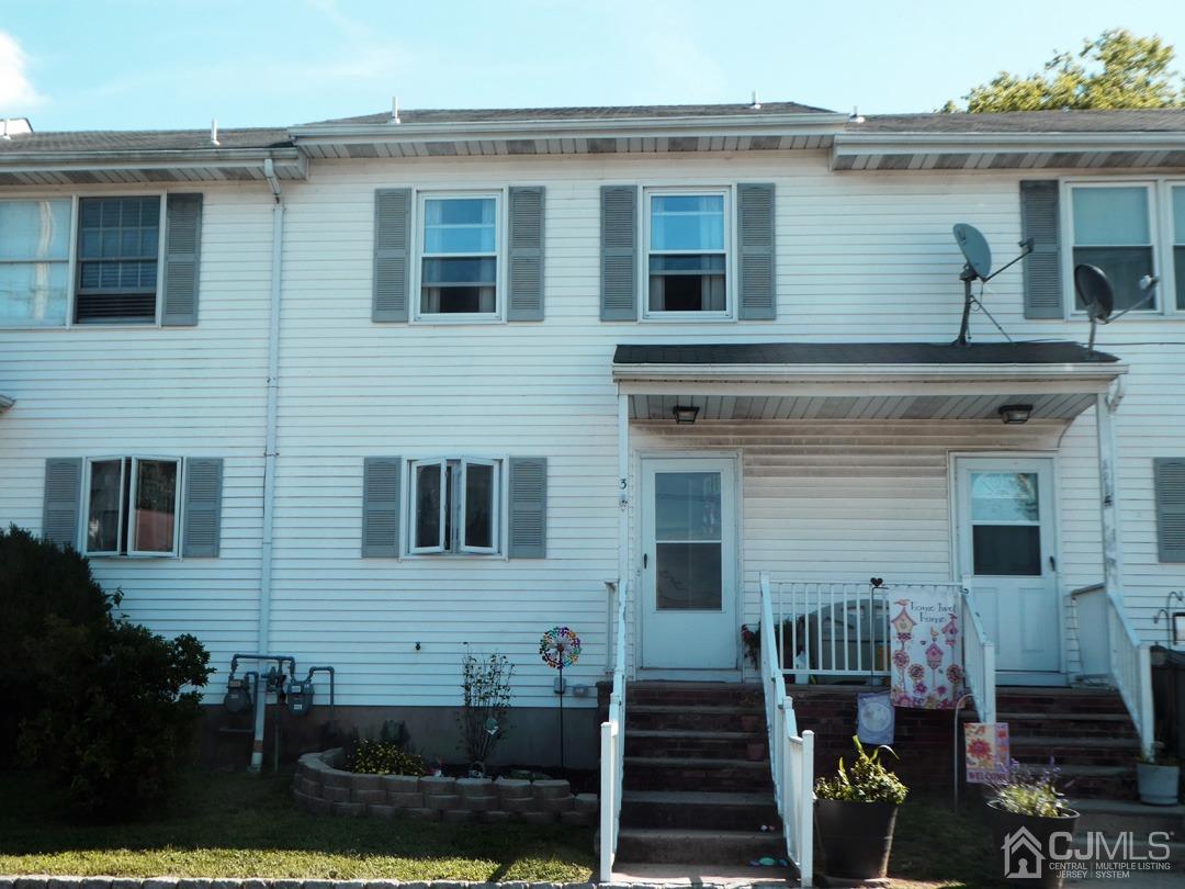 741 Bound Brook Road, Unit 3 Dunellen, NJ 08812 - Photo 1 of 14 a view of a house with wooden fence