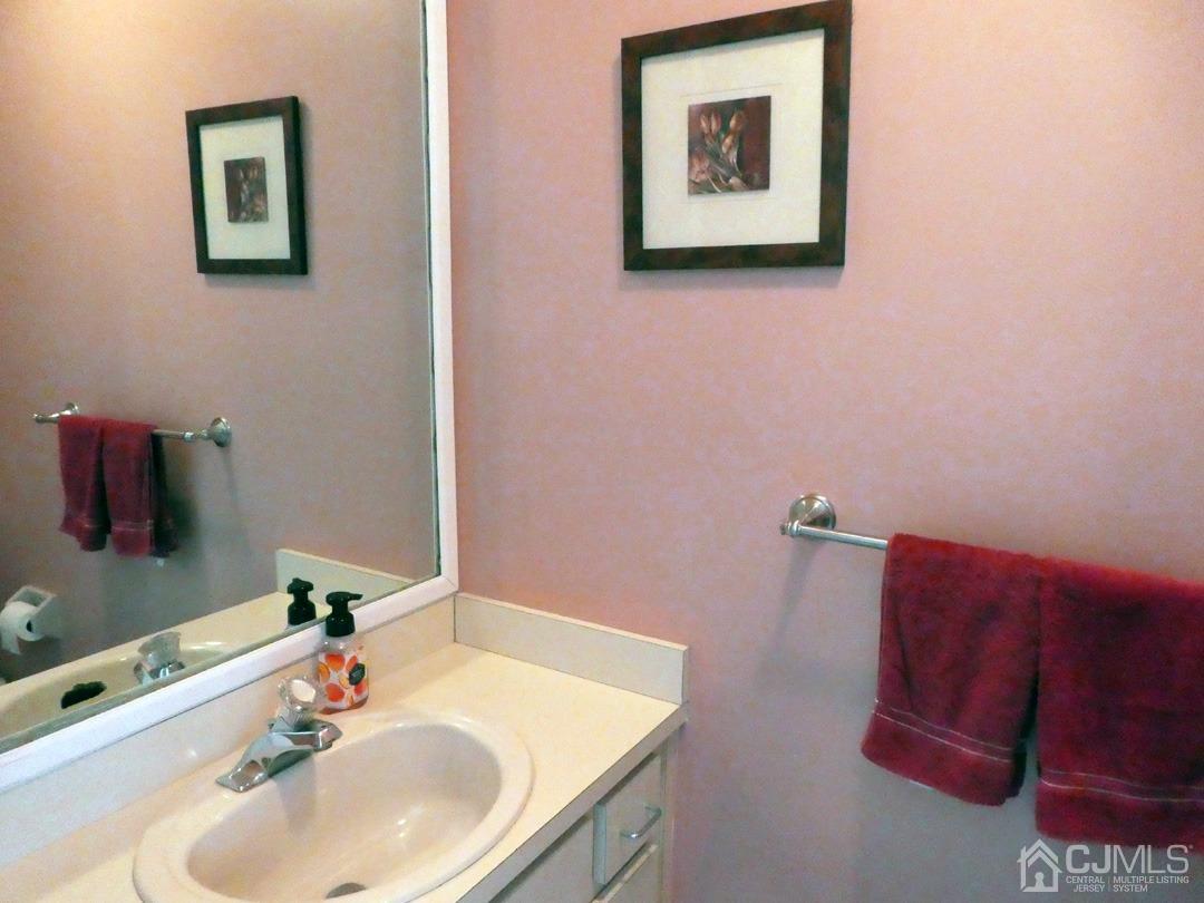 741 Bound Brook Road, Unit 3 Dunellen, NJ 08812 - Photo 11 of 14 a bathroom with a sink and a mirror